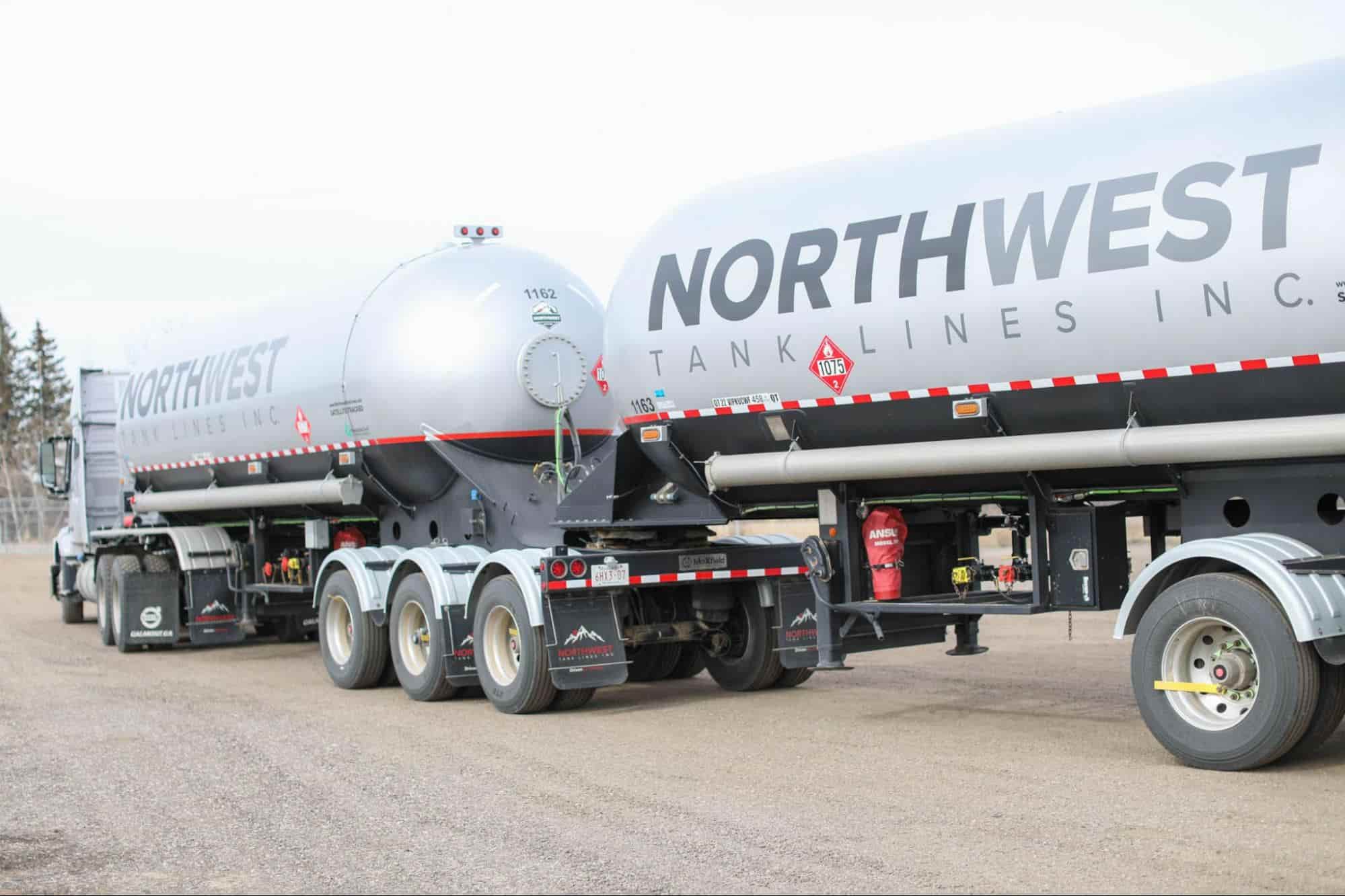 A heavy-duty Northwest Tank Line truck , representing the growing truck driver demand in Canada and the years of specialized training required to become a professional bulk fluid hauling expert.